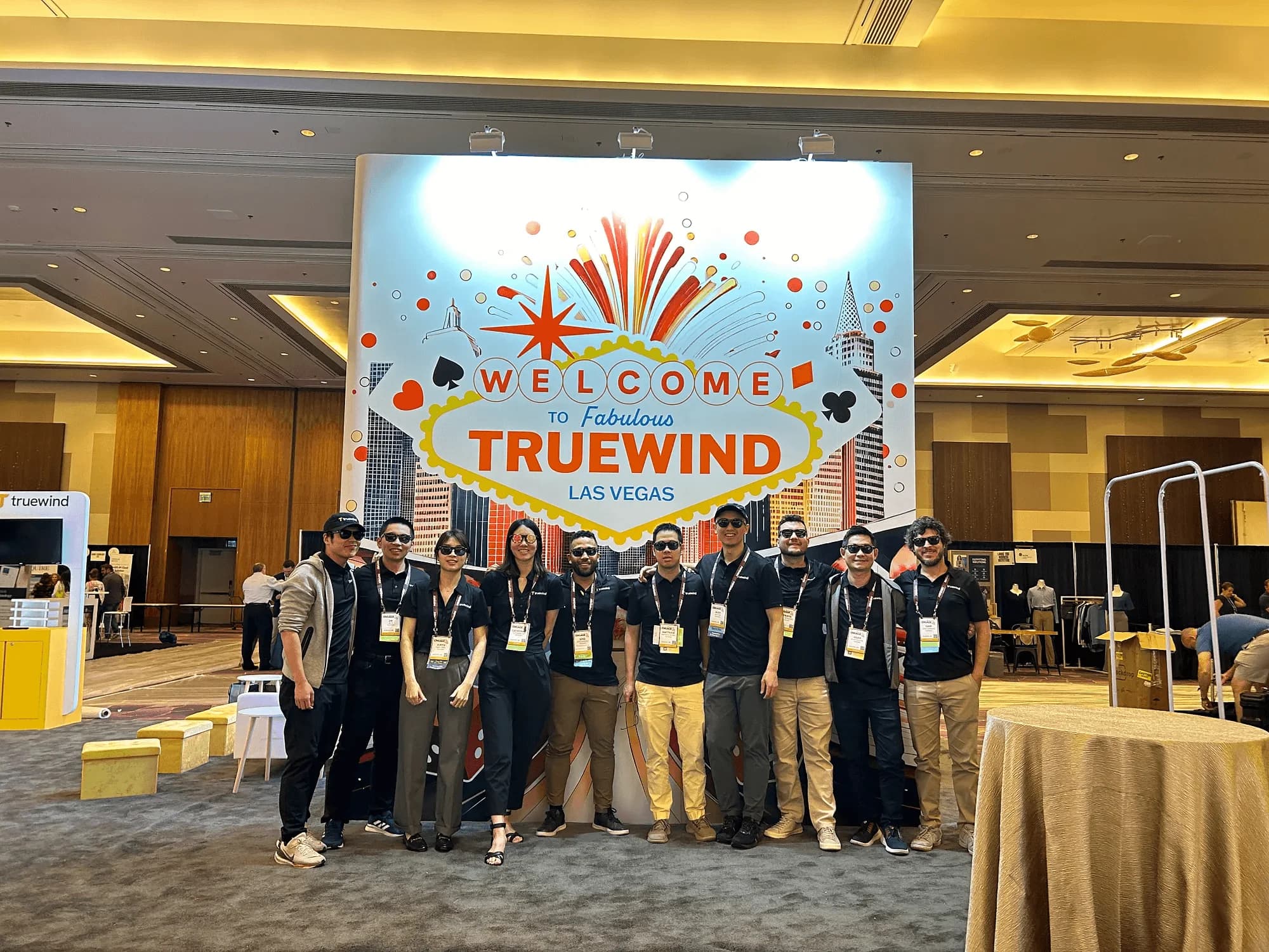 Truewind team together at a conference booth