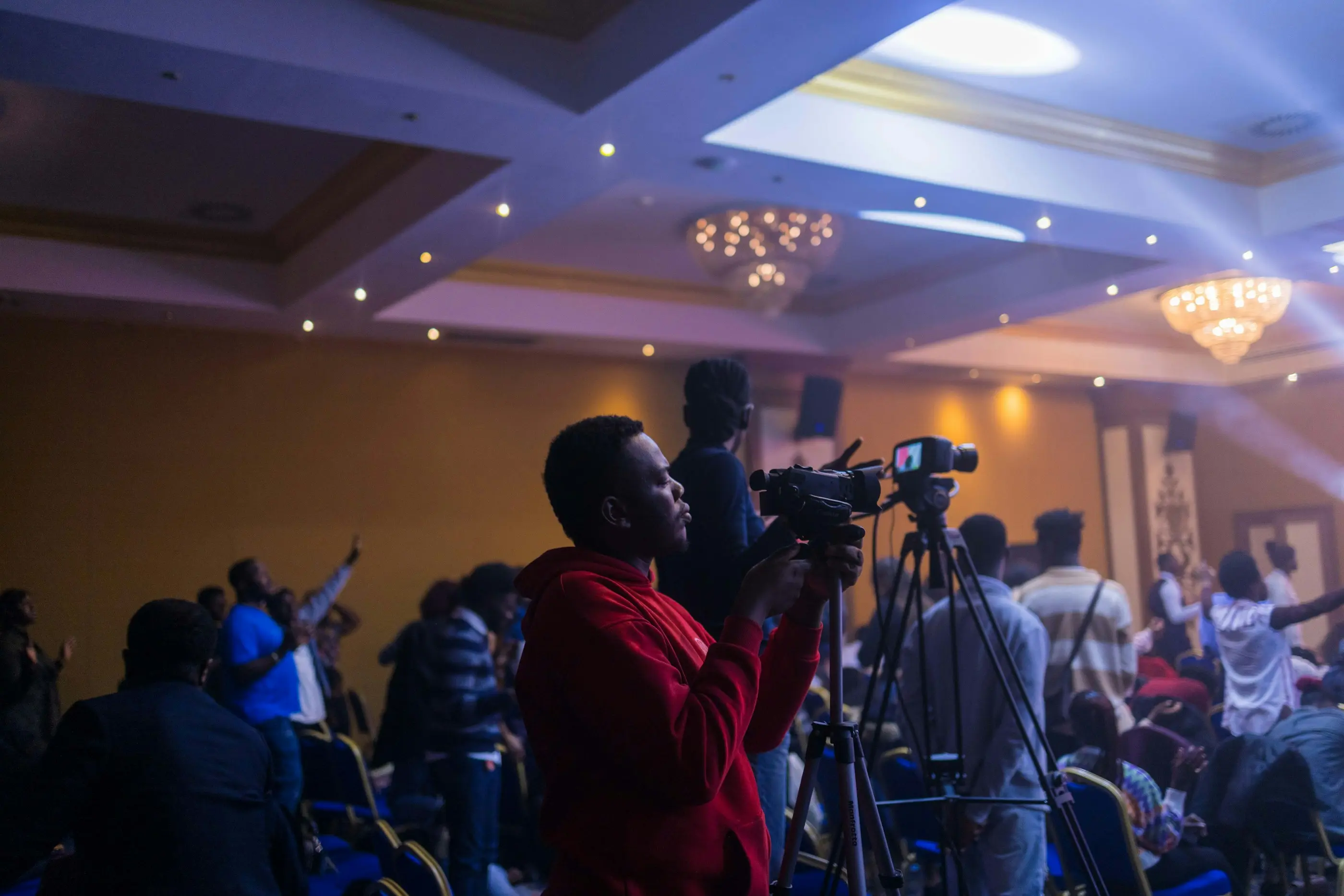 Media production team coordinating cameras and event coverage